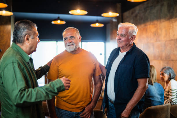Senior friends talking at coffee shop