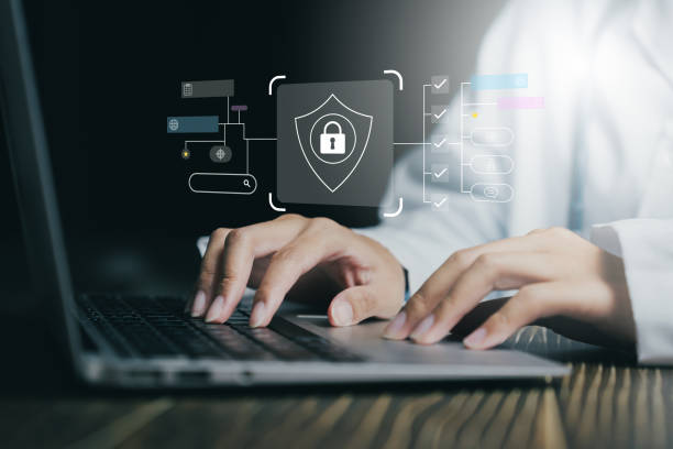 istock Hands typing on a laptop with cybersecurity icons, emphasizing data protection and online security. 2176514065