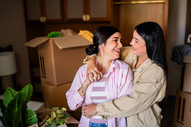 istock Lesbian couple talking embraced at home 2176514370
