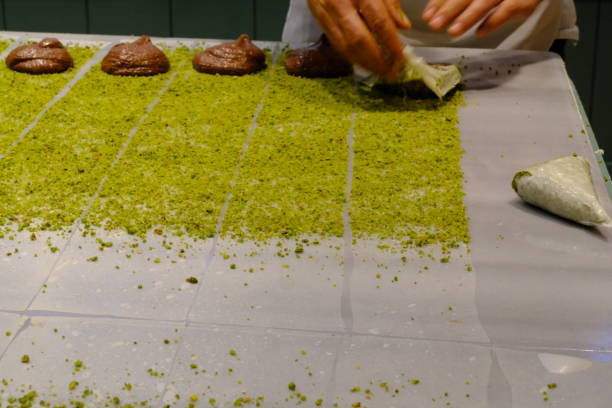 istock A dessert chef makes katmer dessert by folding pistachio and chocolate phyllo pastry. 2176523529