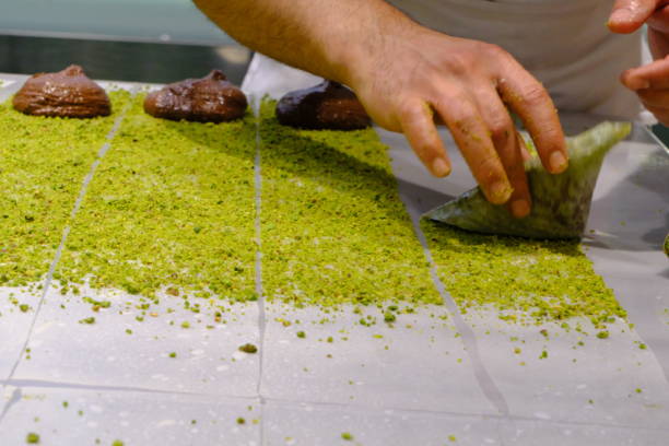 istock A dessert chef makes katmer dessert by folding pistachio and chocolate phyllo pastry. 2176523532