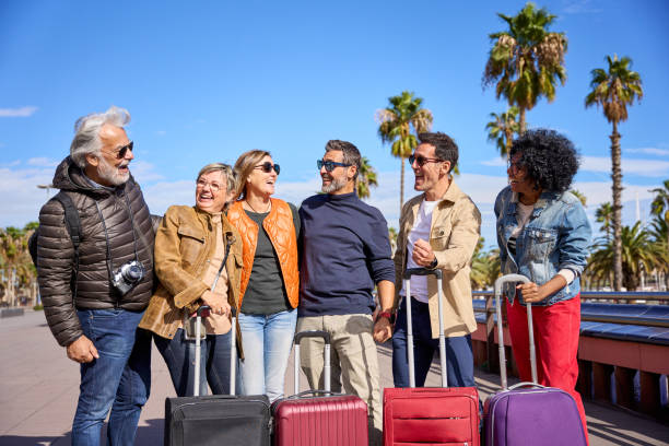 istock Portrait group mature tourist friends embraced in affectionate attitude looking each at other 2176524968