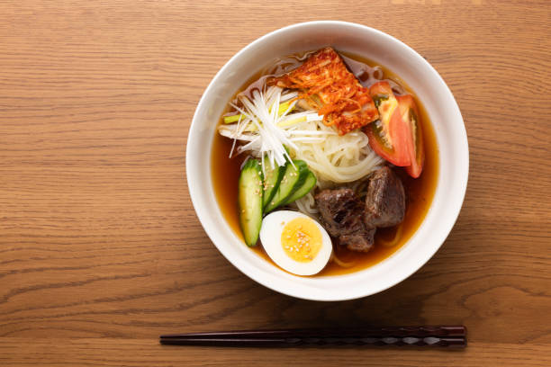 istock korean cold noodles topped with beef, eggs and vegetables 2176533161