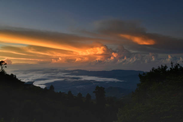 The early morning sunrise over the Perez Zeledon valley is very dramatic.  The formation contains several levels of clouds and colors.  The the very back of the photo you can see the pacific ocean.