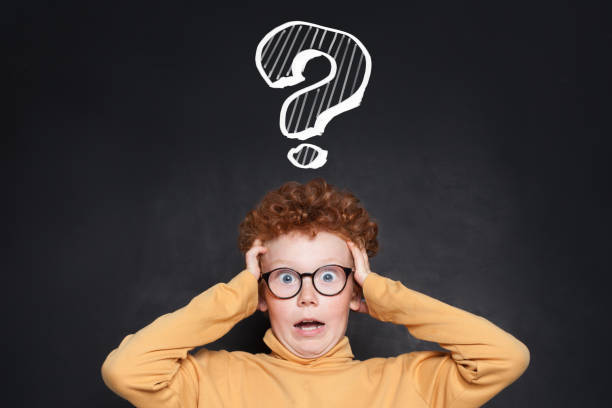 istock Stressed child boy school student with question mark on blackboard. Idea, Problem and Education concept 2176543786