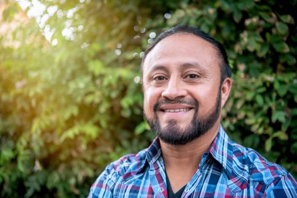 istock Smiling mature hispanic man looking at the camera 2176544319