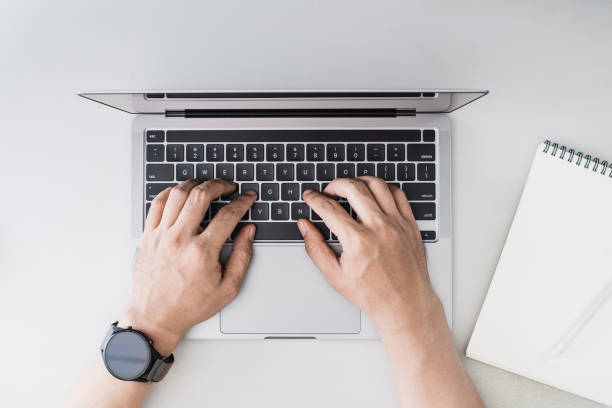 istock Overhead image of person typing on a laptop 2176545642
