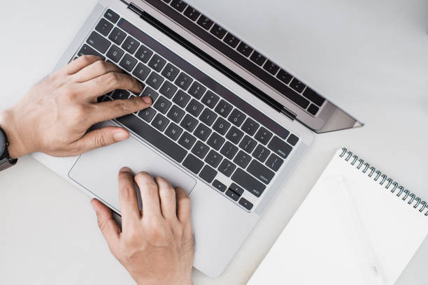 istock Overhead image of person working on a laptop 2176545678