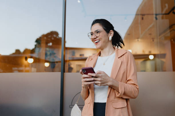 istock Business woman using smartphone on the way 2176551582