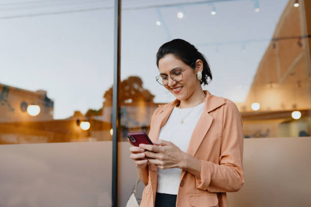 istock Business woman using smartphone on the way 2176551585