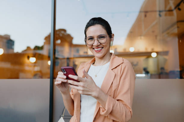 istock Business woman using smartphone on the way 2176551594