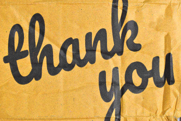 istock thank you wording on cardboard box texture background 2176554491