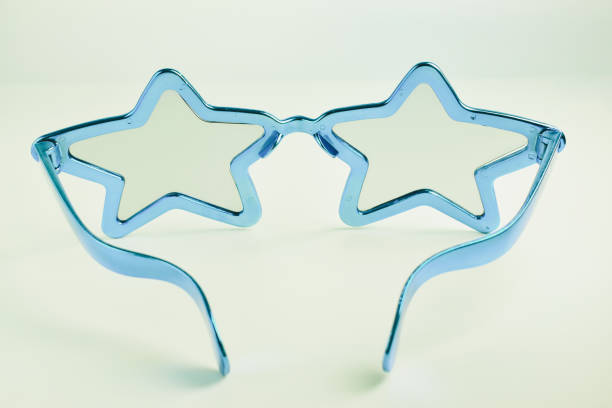 istock blue star shape of glasses on old sepia background 2176557190