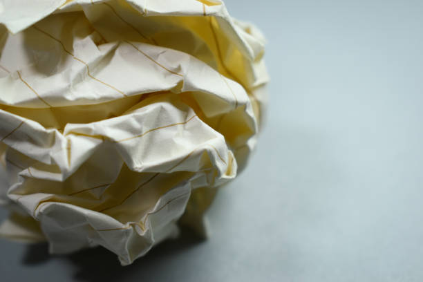 round lump paper on grey background, recycle used paper