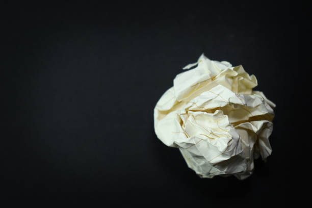 round lump paper on black background, recycle used paper