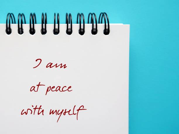 istock Notebook on blue background with text written I Am At Peace with Myself - feeling calm and contented, no emotional conflicts within yourself or with other -  forgive yourself of mistakes 2176558732