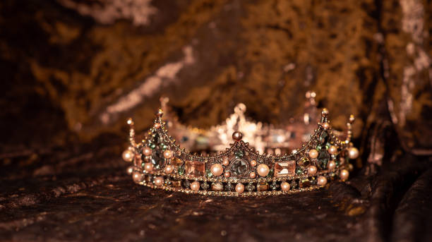 istock Royal crown with gemstones on velvet background 2176559354