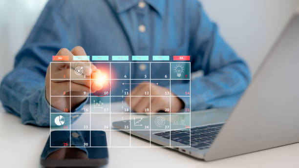 istock Time management concept. Calendar on the virtual screen interface. Businessmen manage time for effective work. Highlight appointment reminders and meeting agendas on the calendar. 2176559608