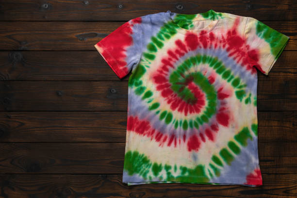istock Colorful Tie-Dye T-Shirt on Rustic Wooden Background 2176566595