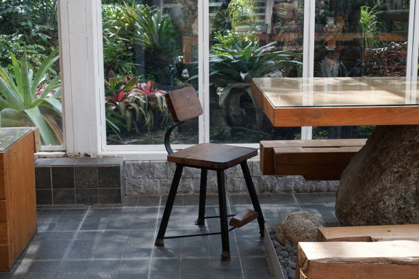 Wooden chair and large wooden tables in coffee shop