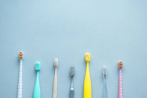 istock Toothbrushes on blue background, top view. Oral care. 2176578093