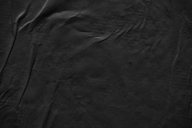 istock Weathered black paper poster texture background 2176579603