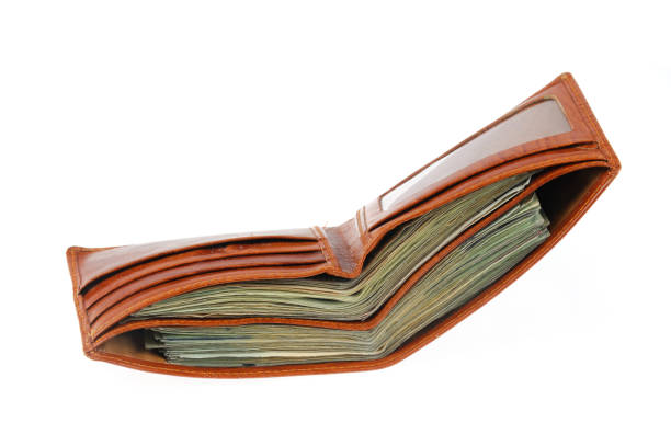 Wallet full of US dollar cash bills