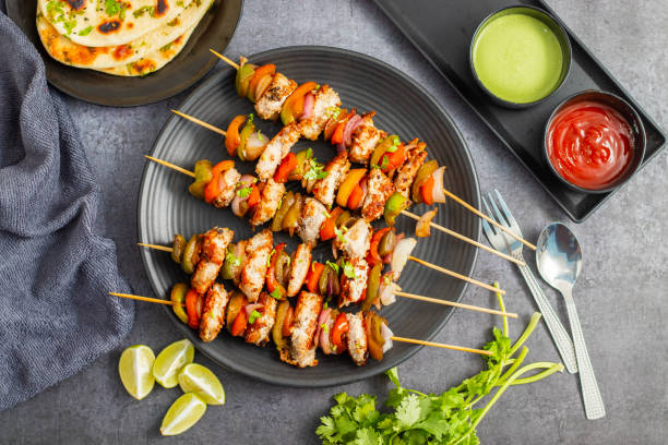 istock Chicken Reshmi Kabab is a succulent, marinated chicken skewer, grilled to perfection, featuring rich spices, creamy yogurt, and aromatic herbs. 2176584512