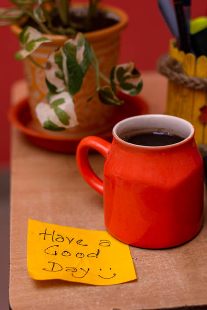 istock Have a Good Day Sticky Note with Coffee Mug on Office Desk 2176587338