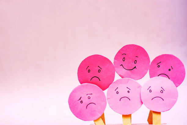 istock Positive Attitude Concept with Smiling Emoji Among Sad Faces 2176587408