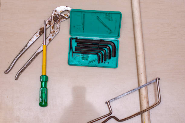 A flat lay photo featuring various domestic tools used for DIY work, ideal for home improvement, repair, and maintenance projects. Perfect for construction or renovation themes.
