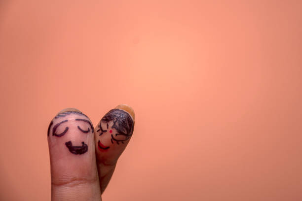 istock Romantic Concept of Two Fingers Hugging as a Couple 2176588378