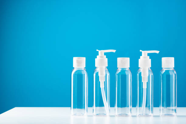 istock Clear plastic bottles with pumps arranged on a table against a bright blue background 2176593786