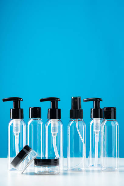 istock Plastic bottles with black caps are neatly arranged on blue background 2176594217