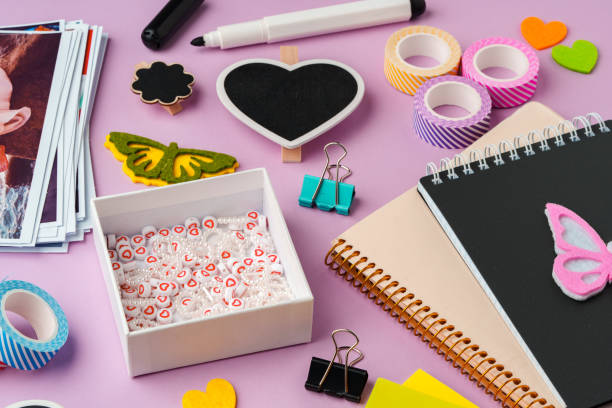 istock Crafting supplies for scrapbooking arranged on a purple surface 2176595779