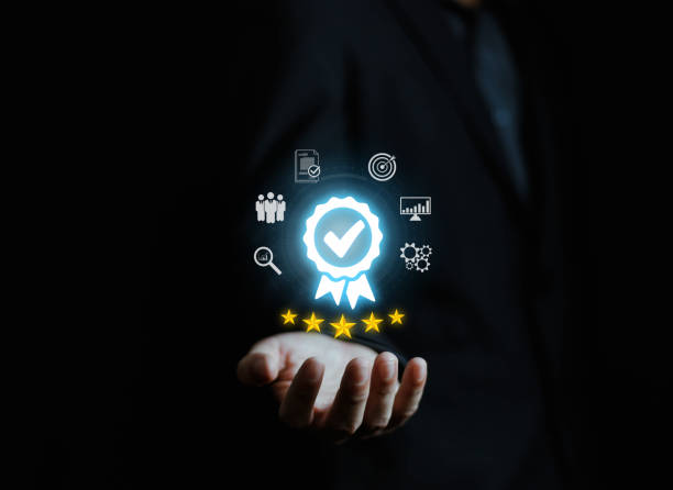 istock Businessman holding quality certification mark, audit, business, assurance, control, digital, service, complete, assessment, checklist, data with quality icon. 2176597041
