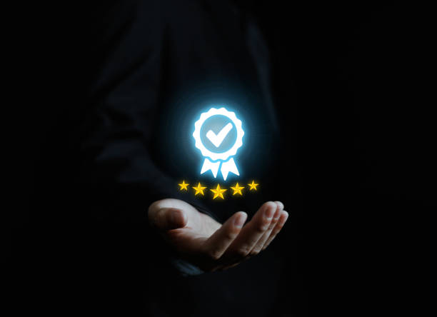 istock Businessman holding quality certification mark, audit, business, assurance, control, digital, service, complete, assessment, checklist, data with quality icon. 2176597046