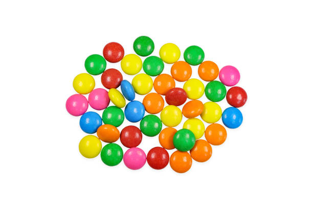 istock Colourful chocolate candies, multicolored glazed chocolate  isolated on white background. 2176599089