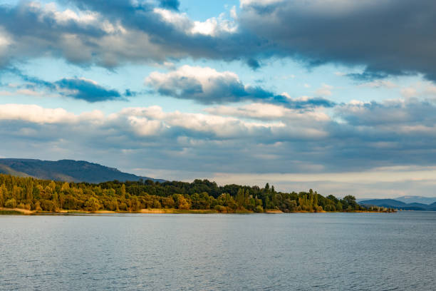 Ship on Lake Balaton in spring sunshine with mountains in the background