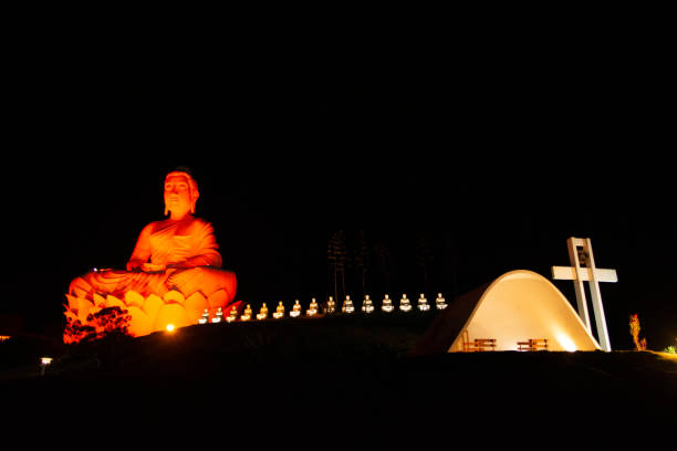 istock Illuminated Buddha Statue on a Hill at Night 2176600442
