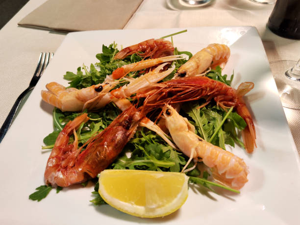 langoustine tasty seafood shrimp prawns delicious fresh meal food snack on the table copy space food background rustic top view keto or paleo diet Pescetarian