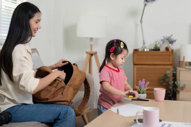 istock Mother and Daughter Teamwork Morning School Preparation 2176601284