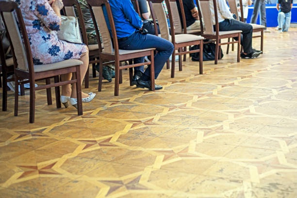 Seminar conference or town hall meeting blur background in auditorium or hotel room with audiences, speaker podium stage and presentation screen for entrepreneurship business speech or community talk.