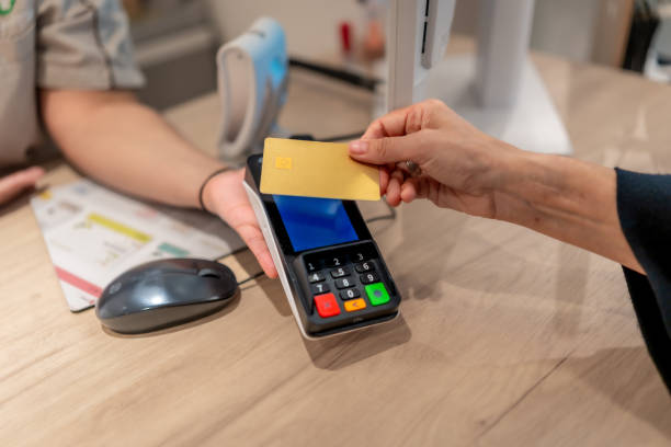 istock Client paying using contactless credit card in a pharmacy 2176603173