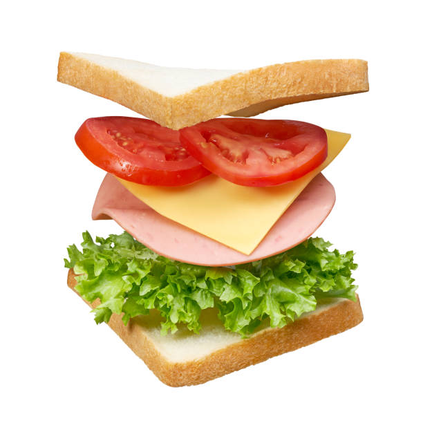 Fresh white bread sandwich with layers of ingredients isolated