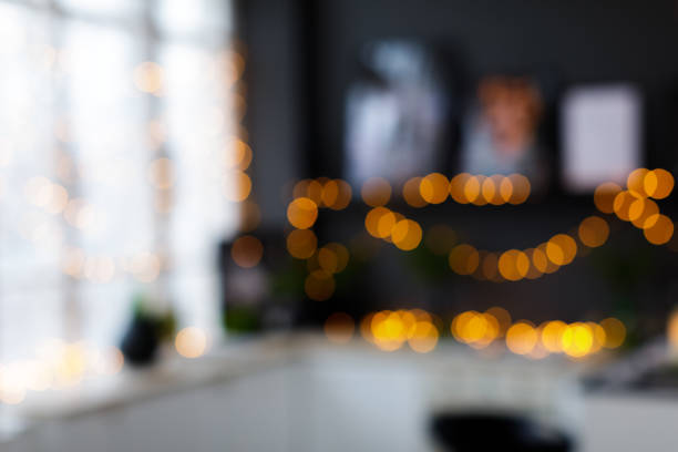 istock blurred christmas interior with golden lights bokeh - Image 2176609360