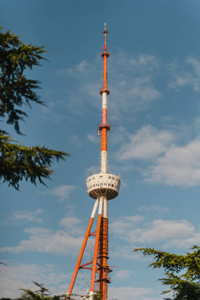 istock A towering marvel against a vibrant blue sky near lush greenery in the afternoon light 2176611332
