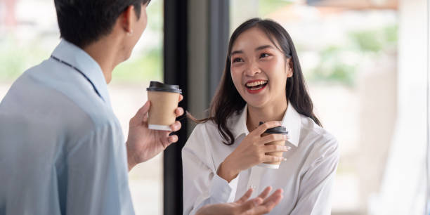 istock Young Professionals Enjoying Conversational Break Over Coffee. Concept of Workplace Connection and Team Dynamics 2176611974