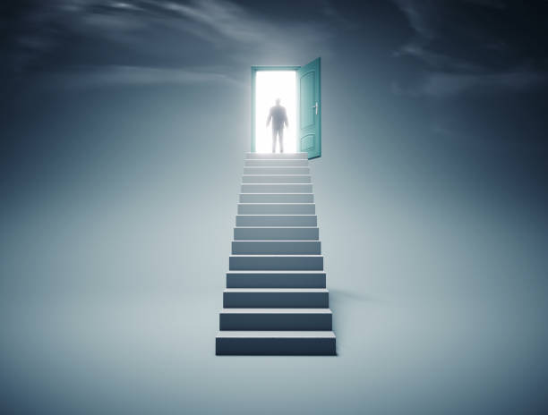 istock Young man climbing stairs to the sky. 2176615542
