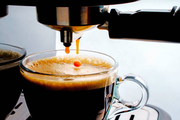 istock Pouring coffee into the coffee cup close up.Automatic coffee machine. 2176618512